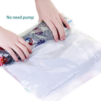 China Reusable Minimalist 24 Pcs Hand Pressing Travel Vacuum Cleaner Storage Bag Compression Sack Roll Up Space Saver Bag for sale