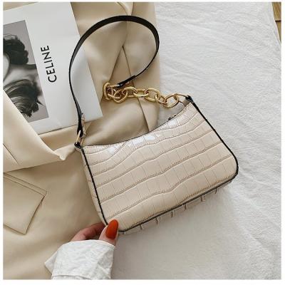 China Fashion on the shoulder bag 2021 new small fashion print armpit bag web chain stone shoulder celebrity stone cross handbag for sale