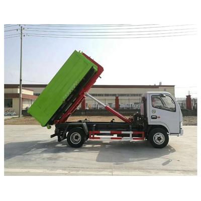 China Hotels Small Size 4 Ton Garbage Collection Hook Lift Garbage Truck Arm With 6CBM Garbage Container for sale