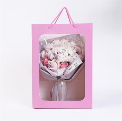 China Recycled Materials Flower Transparent Handbags PVC Bouquet Gift Bag Box Wedding Festival Candy Paper Craft Packaging Bag for sale