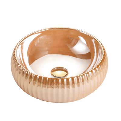 China Modern Ceramic Bathroom Sink Gold Solid Color Gold Outdoor Basin for sale