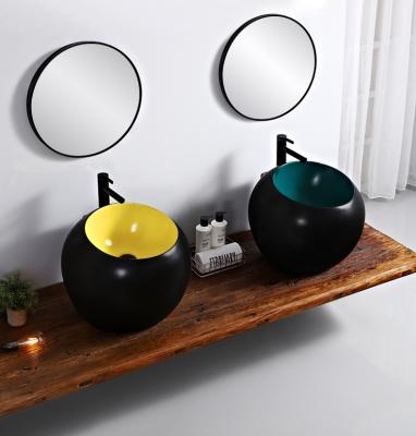 China Industrial Color Ceramic Round Wall Hung Wash Basin Bathroom Matte Black Color Wall Mounted Wash Basin Sink for sale