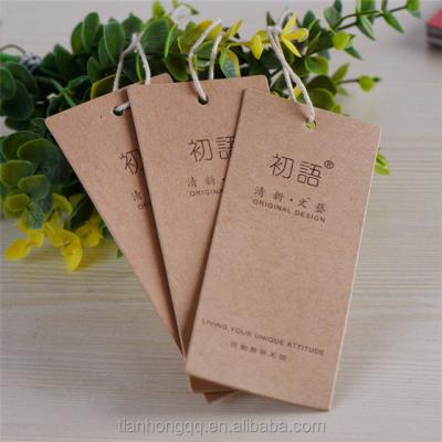 China tyvek new china design sustainable fancy quick jeans recycled kraft paper garment swing paper hanger tag for clothing for sale