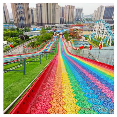 China Hot Selling Plastic Rainbow Snow Slide Amusement Park Amusement Dry Rides For Kids And Children To Have Fun for sale