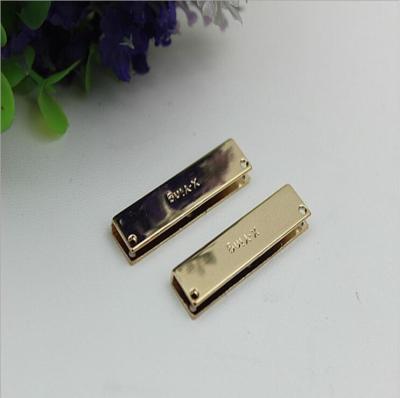 China Custom letter logo light gold 40*10 mm decorative corner protector for handbag for sale