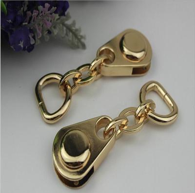 China Top quality zinc alloy light gold handbag zipper slider with iron d ring for sale