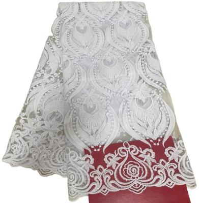 China High Quality Breathable Floral Pattern African Lace White Women Nigerian Wedding Dresses Mesh Fabric With Sequin Beads for sale