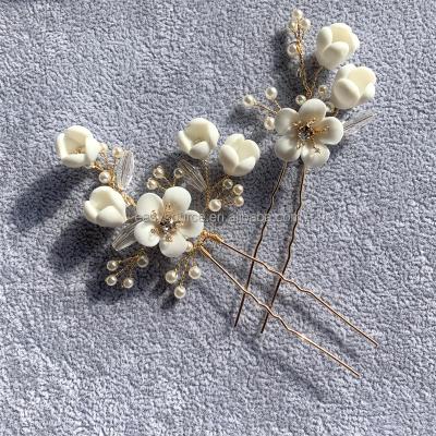 China RE4475 Current Crystal Pearls Bride Gold Hair Combs Porcelain Flower Bridal Hairpins Wedding Hair Accessories for sale