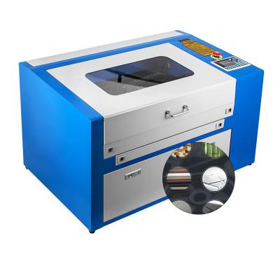 China Laser Engraving Hot Sale 50w CO2 Laser Engraving Machine 300X500mm Textile Cutting for sale