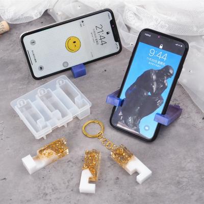 China Viable portable movil de telefono de Molde de soporte Para cell phone holder key chain holder silicone mirror mold for sale