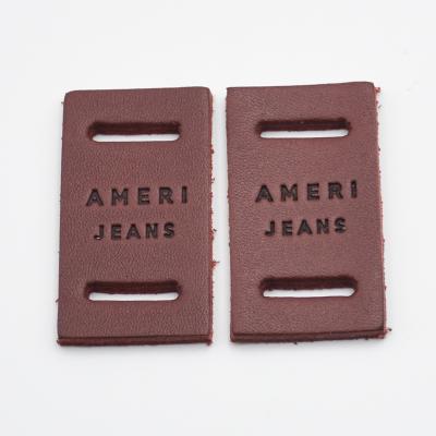 China Sustainable Design Luxury Custom Irregular Logo Jeans Genuine Leather Label Patches For Clothing for sale