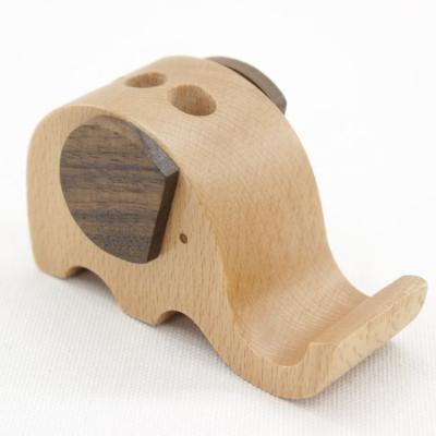 China Factory Wholesale Wooden Gift Adjustable Customized Mobile Desktop Lazy Elephant Phone Stand With Pen Holder for sale