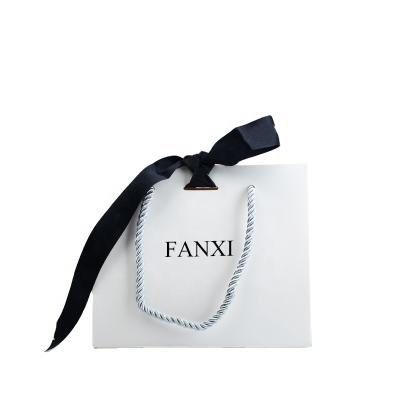 China FANXI Manufacturer Recyclable White And Black Color Drawstring Color China Gift Paper Bag FANXI Bag for sale