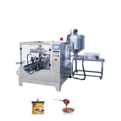 China Food Premade Pouch Automatic 8 Station Chocolate Cream Spreading Center Spouted Rotary Packaging Machine with Piston Filler Liquid for sale