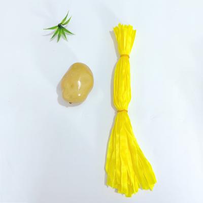 China PP new materials Best Selling Plastic Small Yellow PE Mesh Bag For Vegetables Packing for sale