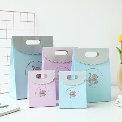 China Small recyclable swan lake gift bag die cut paper bag kids clamshell packaging bag factory delivery for sale