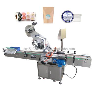 China Automatic food box labeling machine cans Multifunctional automatic labeling machine flat surface top labeler for sale