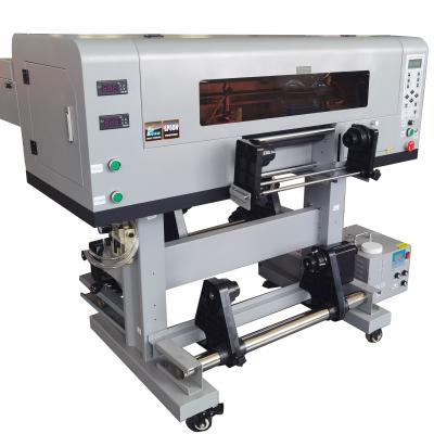 Cina 203.5*107.5*66.5cm EPS UV DTF Stampante con adesivo UV Gold Silver 60cm Roll Machine in vendita