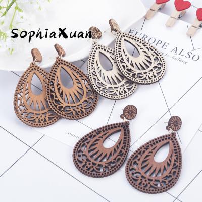 China Wholesale Retro SophiaXuan Fashion Hawaiian Simple Water Wooden Earrings Hollowed Out Wooden Temperament Drop Hawaiian Earrings for sale