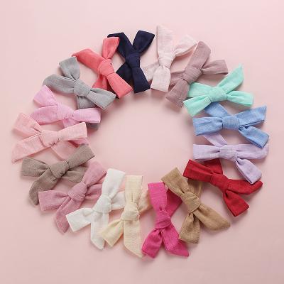 China LOVELY Soft Wholesale Kids Hand Tied Cotton Bamboo Canvas Hangers Hair Clips Knot Hairpins Handmade Hair Clips For Babies for sale