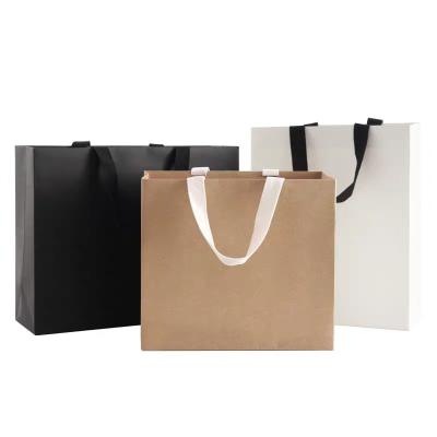 China Recyclable high quality paper shopping bag with ribbon handles with customer logo for clothing, shoes, gift packaging for sale