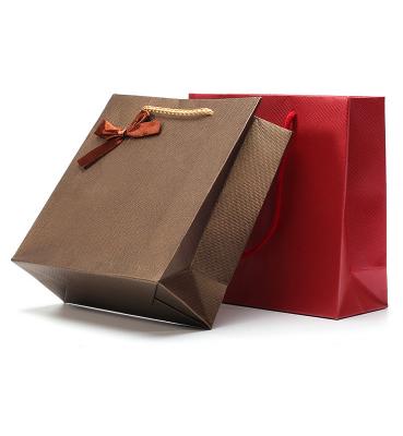 China Recyclable Factory direct sales portable cosmetic jewelry bow kraft paper gift bag for sale