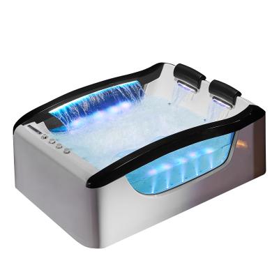 China Luxury Freestanding Waterfall Whirlpool Tub 2 Person Comfortable SPA Bathtub for sale