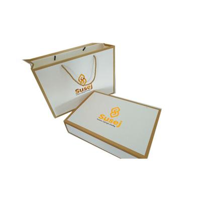 China Gold Stamping Logo Wholesale Clothing Recyclable Custom Luxury Gift Packaging Handbag Shopping Paper Bag for sale