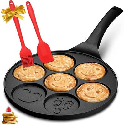 China Unique seven-hole smile face workable frying pan with iron-proof handles for kitchen cookware non-stick pancakes for sale