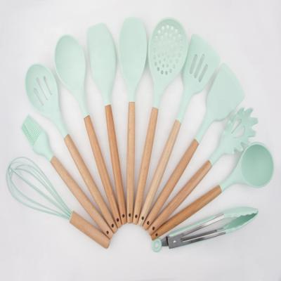 China Sustainable Silicone Kitchenware 12PCS Silicone Utensil Set With Wooden Handle for sale