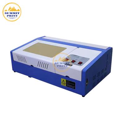 China Water Cooled Summit 3020 CO2 High Quality Laser Engraving Machine for sale