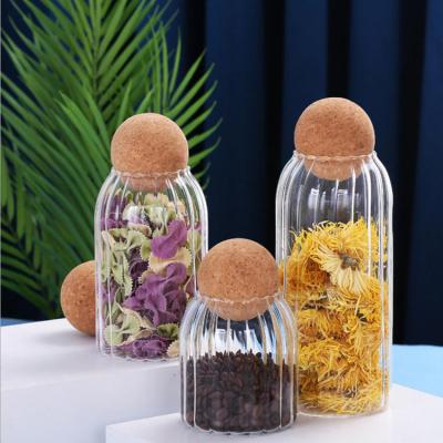 China Ripple Shape Microwavable Food Storage Jars With Wooden Ball Lid Cork Ball Stopper Handmade Borosilicate Lid Storage Glass Jar for sale