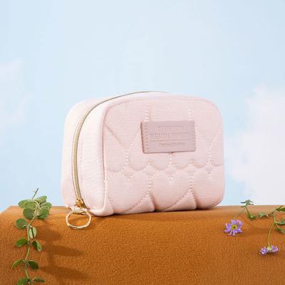 China Rivta Eco-Friendly Bamboo Fiber Patch Quilted Hear Pink Cosmetic Logo Makeup Bag Leather Pouch With Lining for sale