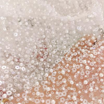 China Viable heavy beaded white sequins with pearls lace up fabric for bridal for sale