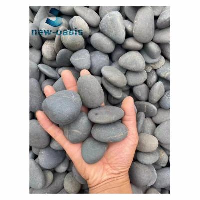 China Black unpolished river pebble stone for sale