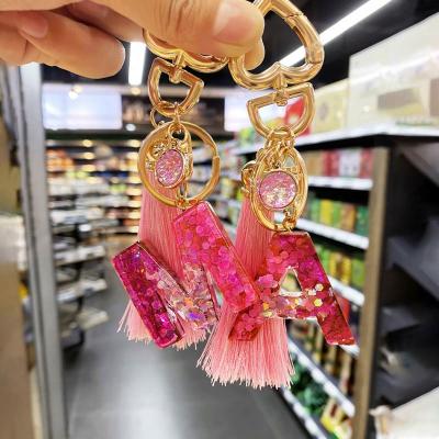 China New Fashion Promotion Gift Initial Letter Keychain Creative Tassel Pink Acrylic A-Z Letter Keychain Charm Bag Couple Bag Gift for sale