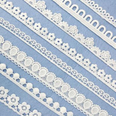 China Viable Wholesale White French Guipure Fabrics Appliques Polyester/Bridal Milk Silk/Micro Fiber Embroidery Lace Trimming for sale