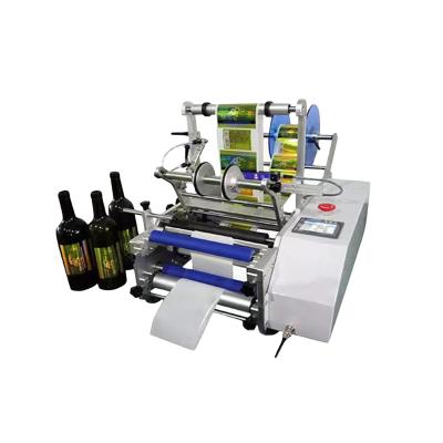 China Small Semi Automatic Round Top Food Tabletop Flask Dropper Tube Container Beer Can Labeling Machine For Pet Plastic Bottles for sale