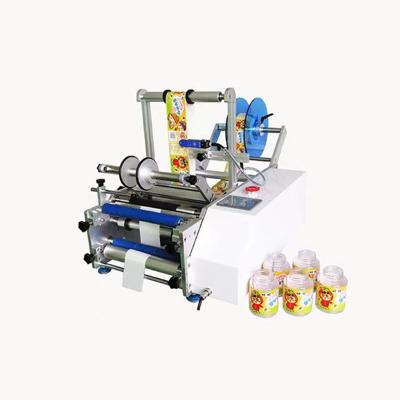 China semi automatic food labeling machine small round bottle semi-automatic plastic sticker machine for sale