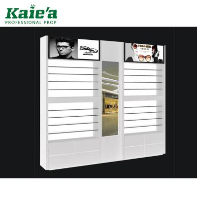 China Modern custom optical wall shop cabinet display wooden sunglass shop rack display with mirror for sale