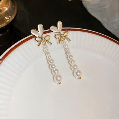 China CLASSIC New Silver S925 Needle Opal Love Zircon Bow Earrings Korean Pearl Earrings for sale