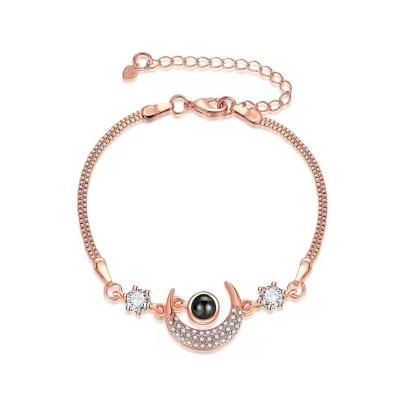 China Hot Selling Shiny Protection Bracelet Style Custom Languages ​​100 I Love Your Projection Photo Star And Moon Bracelet for sale