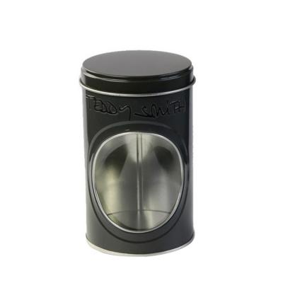 中国 Embossed Black Tins Round Tin Box with Clear Window on Body Decorative Tin Container 販売のため