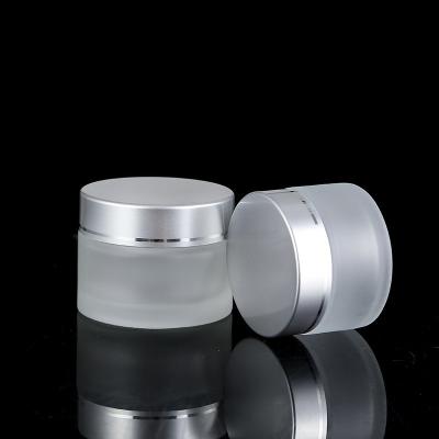 China High Quality Eco-friendly Silver Glass Container Gold Body Face Lip Scrub Eye Cream Facial Containers Jar for sale