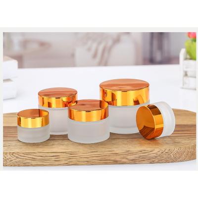 China 5g/10g/15g/20g/50g/60g Eco-friendly Gold Cover Frosted Bottle Glass Makeup Container Body Eye Cream Facial Cream Jar for sale