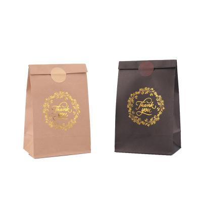 China Biodegradable paper bag supplier gold stamping snack candy packaging gift bag thank you black kraft paper bag for sale