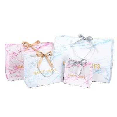 China Manufacturer Custom Printed White Recyclable Cardboard Bags Apparel Shipping Bags Marble Gift Packaging Bags for sale