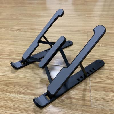 China Adjustable Portable Foldable Tablet PC Stand ABS Portable Desk Stand Mounts Laptop Accessories For Macbook Pro Air Notebook Stand for sale