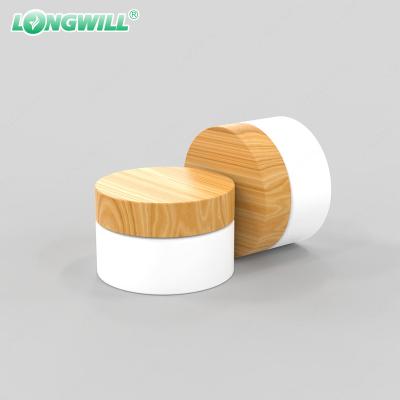 China Custom Screw Cap Straight Sided Glass Storage Cosmetic Logo Bamboo Cap Jars Cosmetic Packaging 2oz 4oz 8oz 16oz for sale