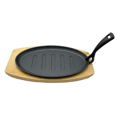 China Wholesale Viable Cast Iron Flat Bottom Plate Steak Sizzling Fish Frying Pan Fajita Pans Skillet With Wooden Handle And Dish for sale